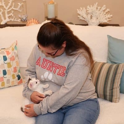 KC cat sitter Laura with a kitten.