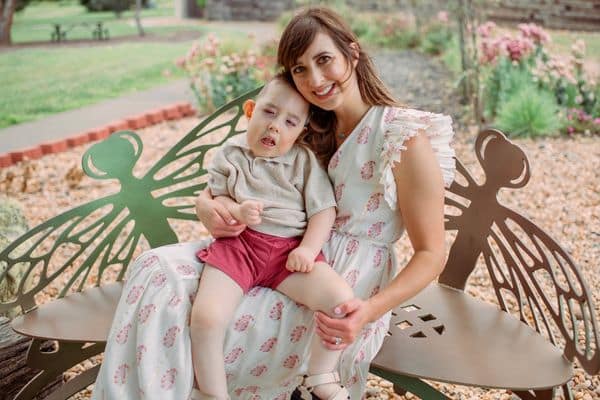 danielle and dax sitting on a bench.